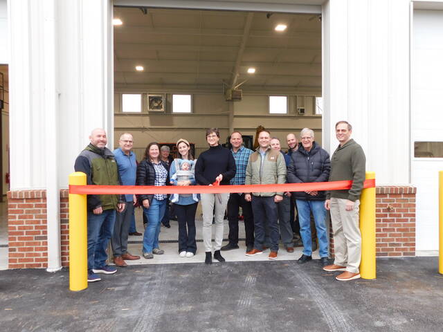 129318214_web1_Ribbon-Cutting
A ribbon-cutting ceremony was held on Jan. 21, 2023, at the City of Lovelands new Public Works Office/Garage Building along Loveland-Madeira Road. From left: Councilmember John Hart, City Manager David Kennedy, City Engineer Cindy Klopfenstein, Monica Neihaus of Melink Solar, (with scissors) Mayor Kathy Bailey, Public Works Director Scott Wisby, Phil Hesselbrock of DER Development, Assistant City Manager Cory Wright, Dale Roe of DER Development, Councilmember Kent Blair and Councilmember Kip Ping. Photo courtesy the city of Loveland.