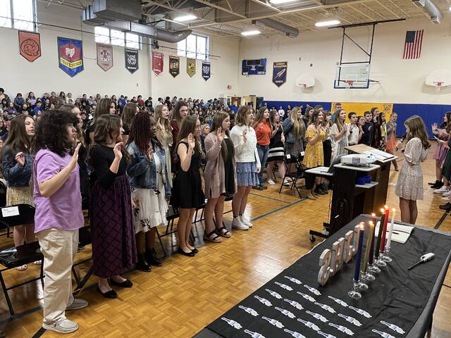 129469735_web1_njhs-oath
The newest members of Clermont Northeastern Middle Schools National Junior Honor Society chapter take their oaths during ceremonies March 2, 2023, at the school. Photo by Dick Maloney.