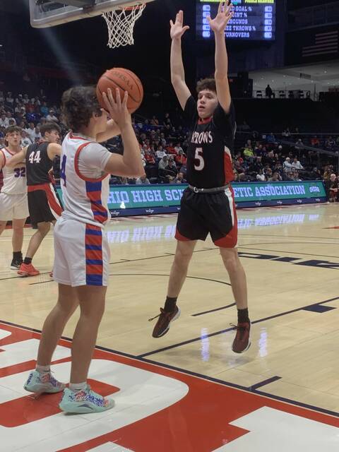 130427075_web1_Burg-3524
Senior Pierce Ayers attempts to inbound the ball during a March. 5, 2024, district final matchup at Dayton Arena.