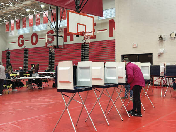 130470791_web1_thumbnail_IMG_4870
A voter cast their ballot at the Goshen High School polling location on Primary Election Day on March 19, 2024.