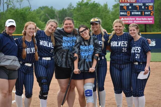 130593368_web1_West-Cler
Members of the West Clermont senior class pose for a picture with their coaches after a 10-9 walk off win on senior day. Photo provided.