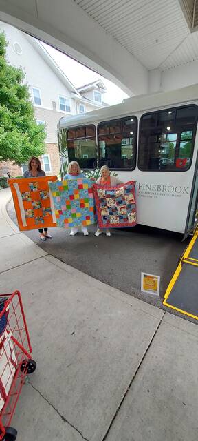 130828984_web1_RMD-20House-201
From left, Pinebrook Community Life Director Karen DeHart and residents Peggy Conley and Pat Fight display the quilts donated. Photo courtesy Watermark Retirement Community.