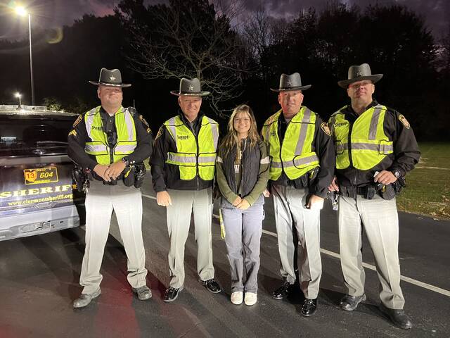 131047041_web1_IMG_7609
BTHS Student/Ohio Student Safety Advisory Council member Grace Tolliver and Clermont County Sheriffs Deputies in the background during a recent morning seatbelt check at Bethel-Tate High School. Photo courtesy Bethel-Tate Local Schools.