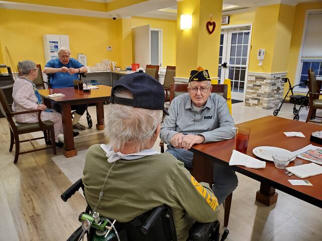 131386908_web1_20250213_180335
Disabled American Veterans (DAV) Department of Ohios current Department Representative for the Southern Ohio Veterans Home Raymond Hutchinson (left) talks to a Korean War veteran (right) following a Special Meal at the Home. It is truly a job to talk to veterans at the Home who were in the Korean War because these were the military who fought in the Forgotten War, stated the former DAV Department Hospital Chairman. These Special Meals mean a lot to the veterans here and they look forward to enjoying them.
Hutchinson concluded, When they try to thank the DAV for providing these meals, concluded Hutchinson, I tell them we should be thanking them for our freedom and their past military service to America. Photo courtesy DAVA Unit #63 Commander Shirley Plahovinsak.