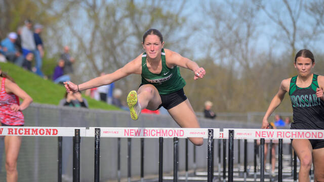 131457255_web1_New-Richmond-Invitational Batavias Riley Van Frank clears a hurdle in the girls 100-meter event April 16, 2025, at the New Richmond Lions Invitational at New Richmond High School. Photo by Sun Sports Reporter Jake Dowling