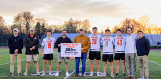 
			
				                                Current and former Loveland players and coaches pose at midfield during halftime of an Eastern Cincinnati Conference match April 16, 2025, against Walnut Hills. The halftime ceremony honored the Loveland program’s 300th game as a Division I team.
                                 Photo by Sun Sports Reporter Jake Dowling

			
		