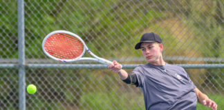 Bethel-Tate’s Gabe Powers returns the ball during a first singles match April 17, 2025, in a National Division match against Clermont Northeastern at Clermont Northeastern High School. Photo by Sun Sports Reporter Jake Dowling