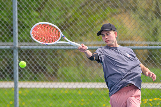 131475159_web1_Bethel-Tate-at-CNE-Boys-Tennis Bethel-Tates Gabe Powers returns the ball during a first singles match April 17, 2025, in a National Division match against Clermont Northeastern at Clermont Northeastern High School. Photo by Sun Sports Reporter Jake Dowling