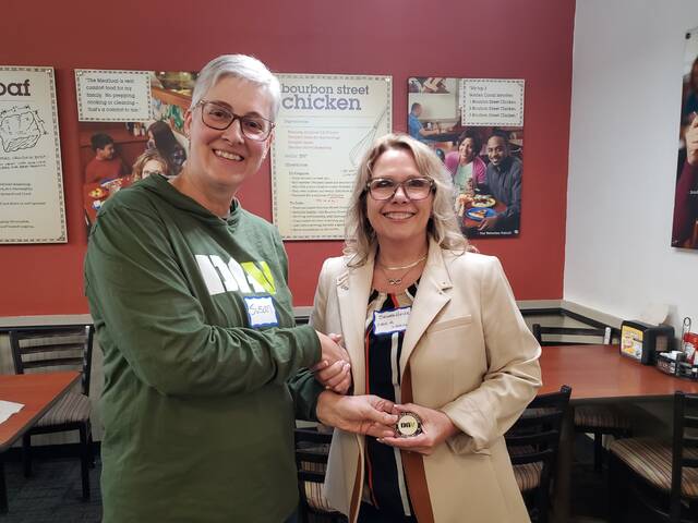 131495048_web1_20250410_191545
USMC Marine Susan Ward, Moderator of the Fifth Women Veterans Dinner (left), presents an official Disabled American Veterans (DAV) Challenge Coin to the Save A Warrior (SAW) Director of Development Suzette Heller (right), following her presentation. Army Veteran Heller discussed how the free SAWs C-PST Program can make a direct impact on the lives of the female veterans attending the dinner and many veterans were sincerely interested. This dinner was the fifth in a series of dinners that the DAV Department of Ohio and DAV Chapter #63 recognizes the contributions that female veterans made to the defense of our country. Photograph provided by DAVA Unit Commander Shirley Plahovinsak.