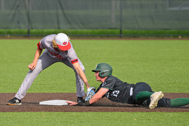 131501529_web1_Goshen-at-Batavia-Baseball Batavias Mason Patrick (13) slides under the tag of Goshens Aiden Whitaker during an American Division game May 7, 2025, at Brian Wilson Field at Batavia High School. Photo by Sun Sports Reporter Jake Dowling
