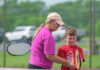 Bethel-Tate head tennis coach Lori Lenhart works with Henry Wyatt during the Bethel Area Tennis Association Community Tennis Program’s Swing, Hit and Ace camp May 15, 2025, behind Bethel-Tate Middle School. Photo by Sun Sports Reporter Jake Dowling