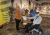 
			
				                                National American Disabled Veterans (DAV) Donation Foundation Representative Alice Gries, on left, displays checks received from Chapter #63 (Clermont County) Commander James Stanzak, seated, while Chapter #63 Treasurer Susan Ward (standing) observed. The checks totaled $6,900 and they were “doubled” by the DAV National Headquarters, yielding a total of $13,800 for the DAV Juist b’ Kids Scholarship Program. These are sufficient funds to send twenty-three (23) kids to Camp Corral, a one-week summer camp for children whose parents were either killed in action, wounded or suffered permanent disability, while serving in the United States Armed Forces. Photo by Shirley Plahovinsak, DAVA Unit #63 (Clermont County).
 
			
		