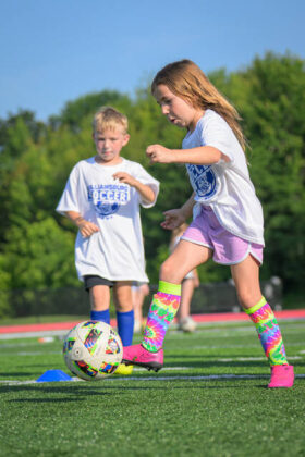 Madi Bowling dribbles with the ball in front of Jonah Herrmann on June 24, 2025, at the Williamsburg Soccer Camp at Ken Osborne Field at Abrams Stadium in Williamsburg. Photo by Sun Sports Reporter Jake Dowling