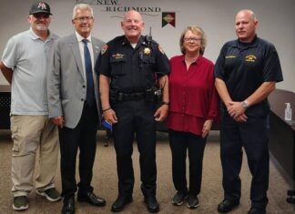 
			
				                                Scott Noel, pictured in the center of the photo, is the new police chief of New Richmond. Photo provided.
 
			
		