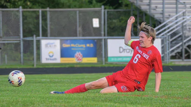 Bethel-Tates Tyler Hahn kicks the ball into the Blanchester net during the first half of a National Division match Sept. 17, 2026, at Bethel-Tate High School.
                                 Jake Dowling/The Clermont Sun