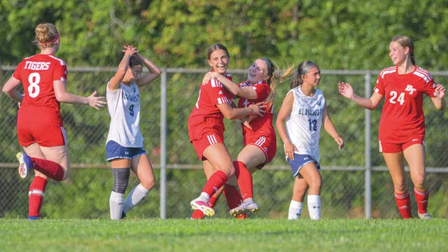 Bethel-Tates Brynn Ross, left, and Shelby Swader celebrate after Ross match-tying goal in the second half of a National Division match Sept. 17, 2026, against Blanchester at Bethel-Tate High School.
                                 Jake Dowling/The Clermont Sun